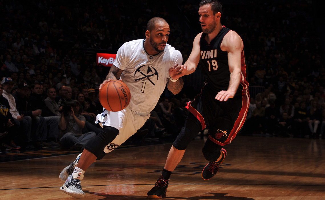 DENVER, CO - JANUARY 15, 2016: Jameer Nelson #1 of the Denver Nuggets drives to the basket during the game against Beno Udrih #19 of the Miami Heat on January 15, 2016 at the Pepsi Center in Denver, Colorado. 

Copyright 2016 NBAE (Photo by Bart Young/NBAE via Getty Images)